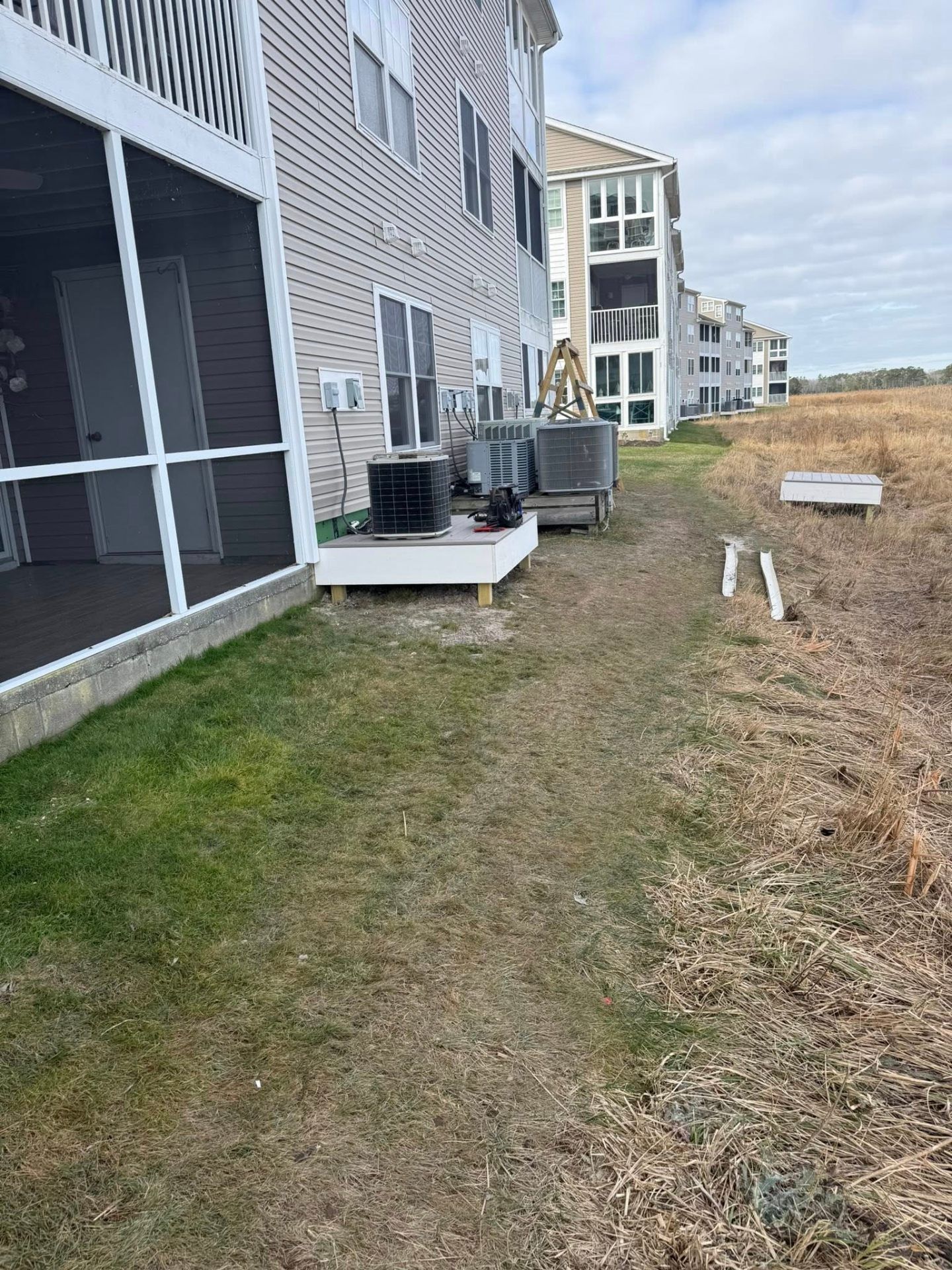 AC condensers on elevated platforms at coastal condos